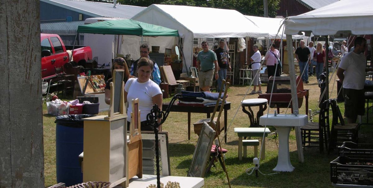 People browsing an antique show