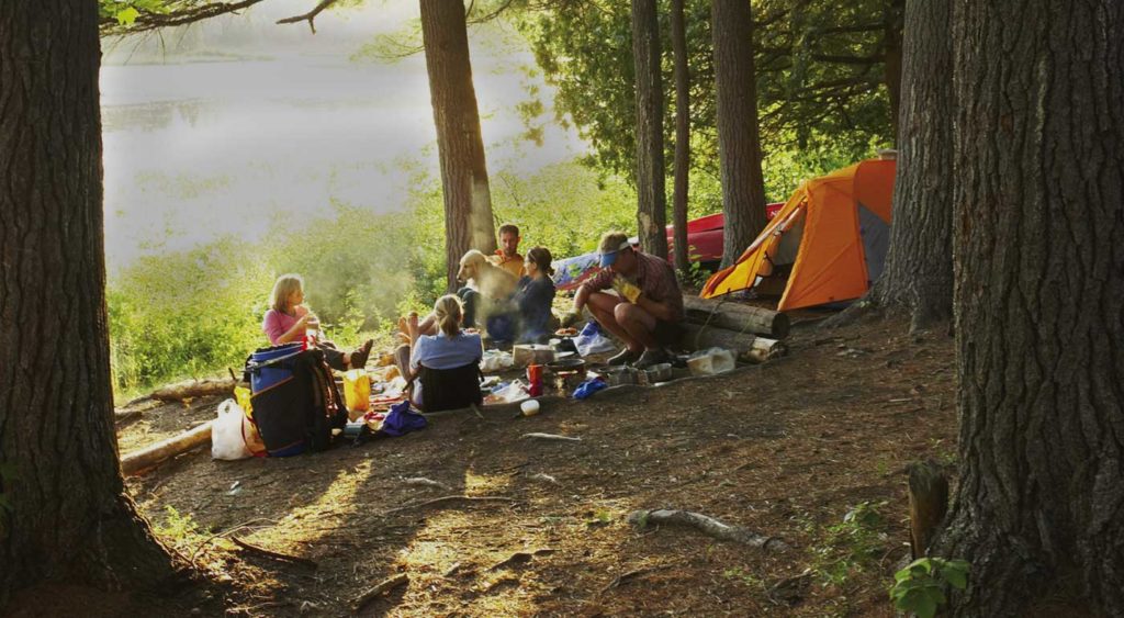 Family camping by a lake