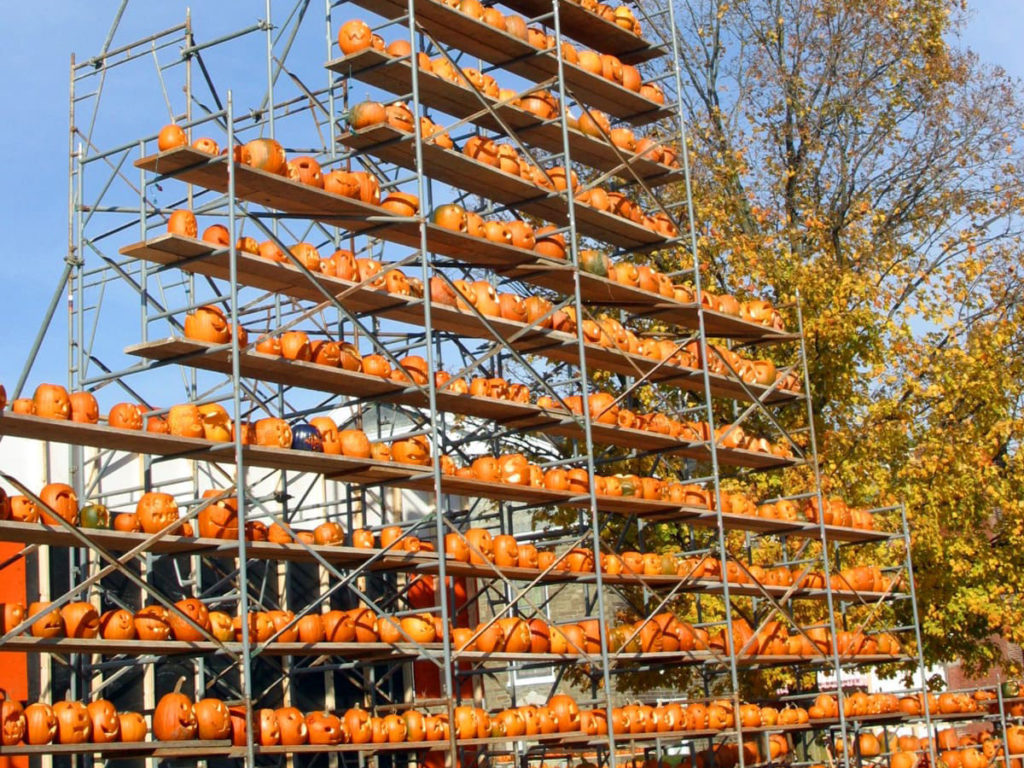 Pumpkins stacked on scaffolding