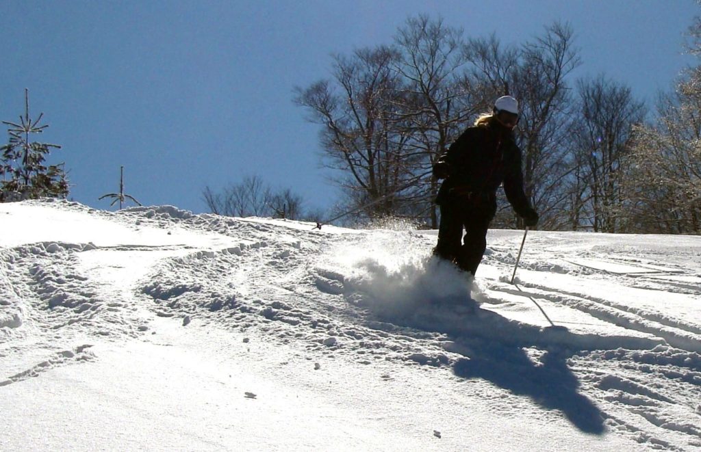 Person skiing down McCauley Mountain