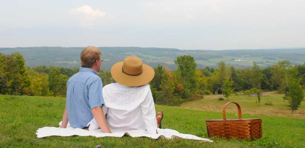 Couple look at the view of hills