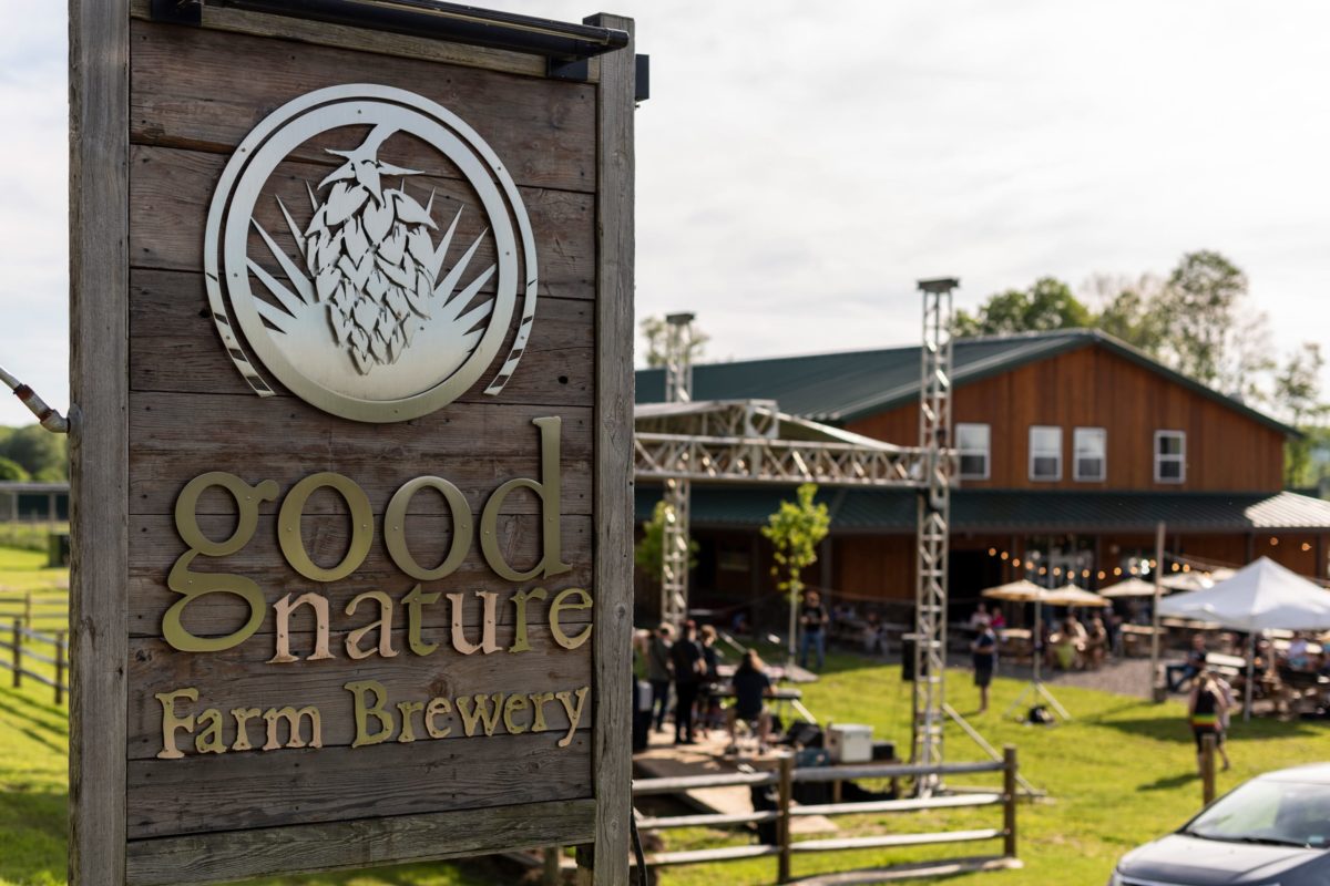 Good Nature Farm sign in front of the building