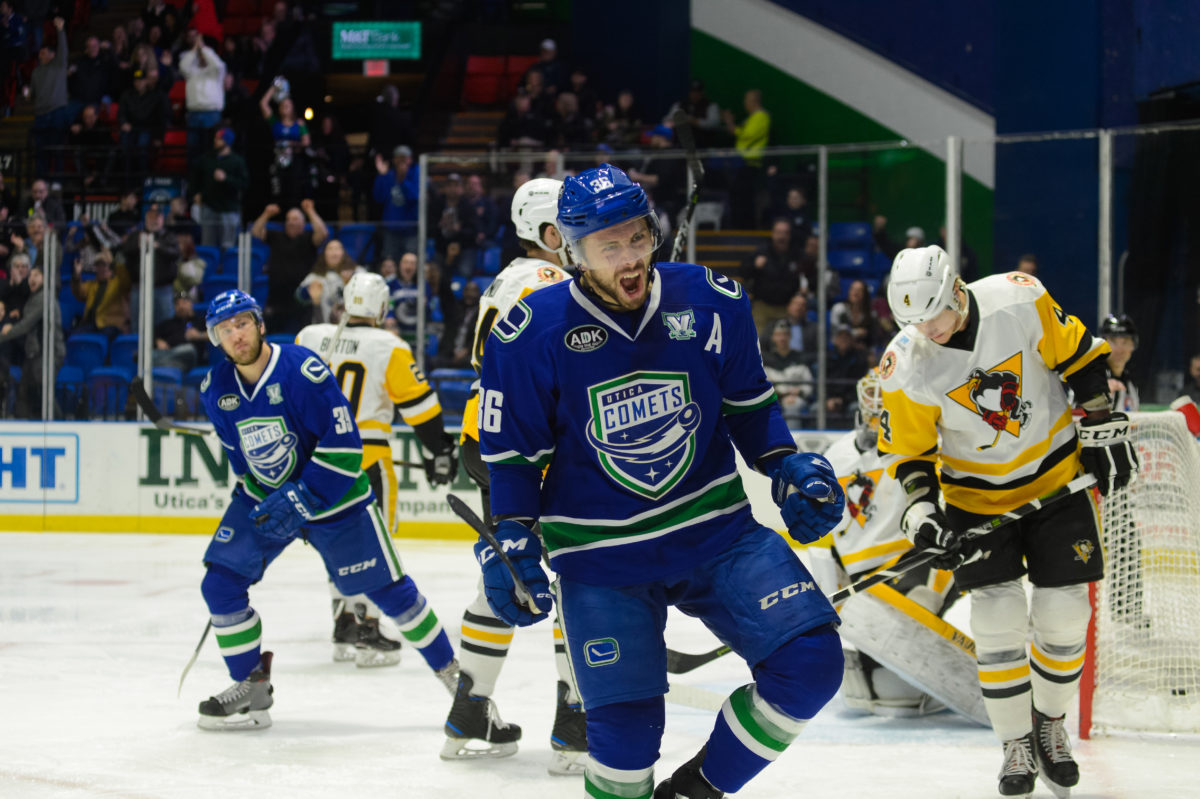 Hockey player celebrating a score on goal